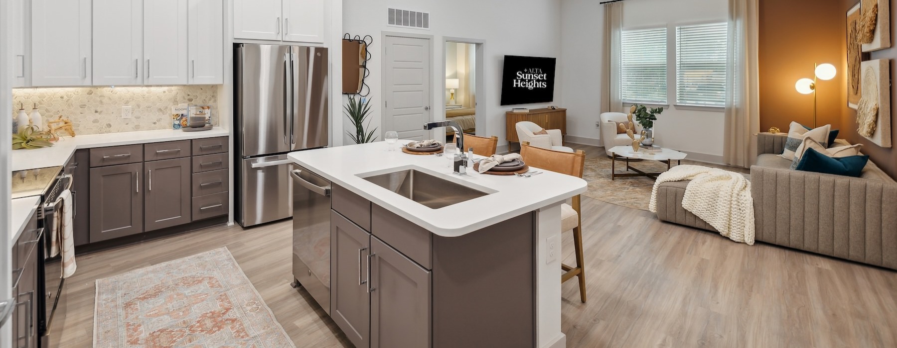 a kitchen with a couch and a sink