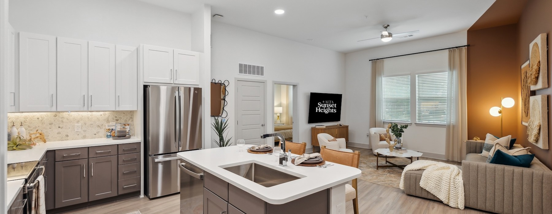 a kitchen with a couch and a sink